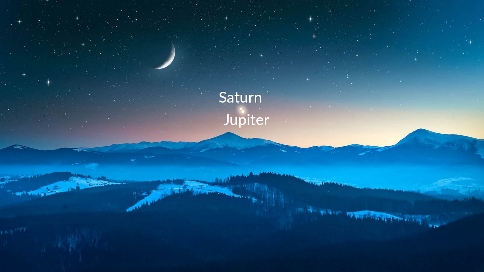 Jupiter and Saturn over blue mountains