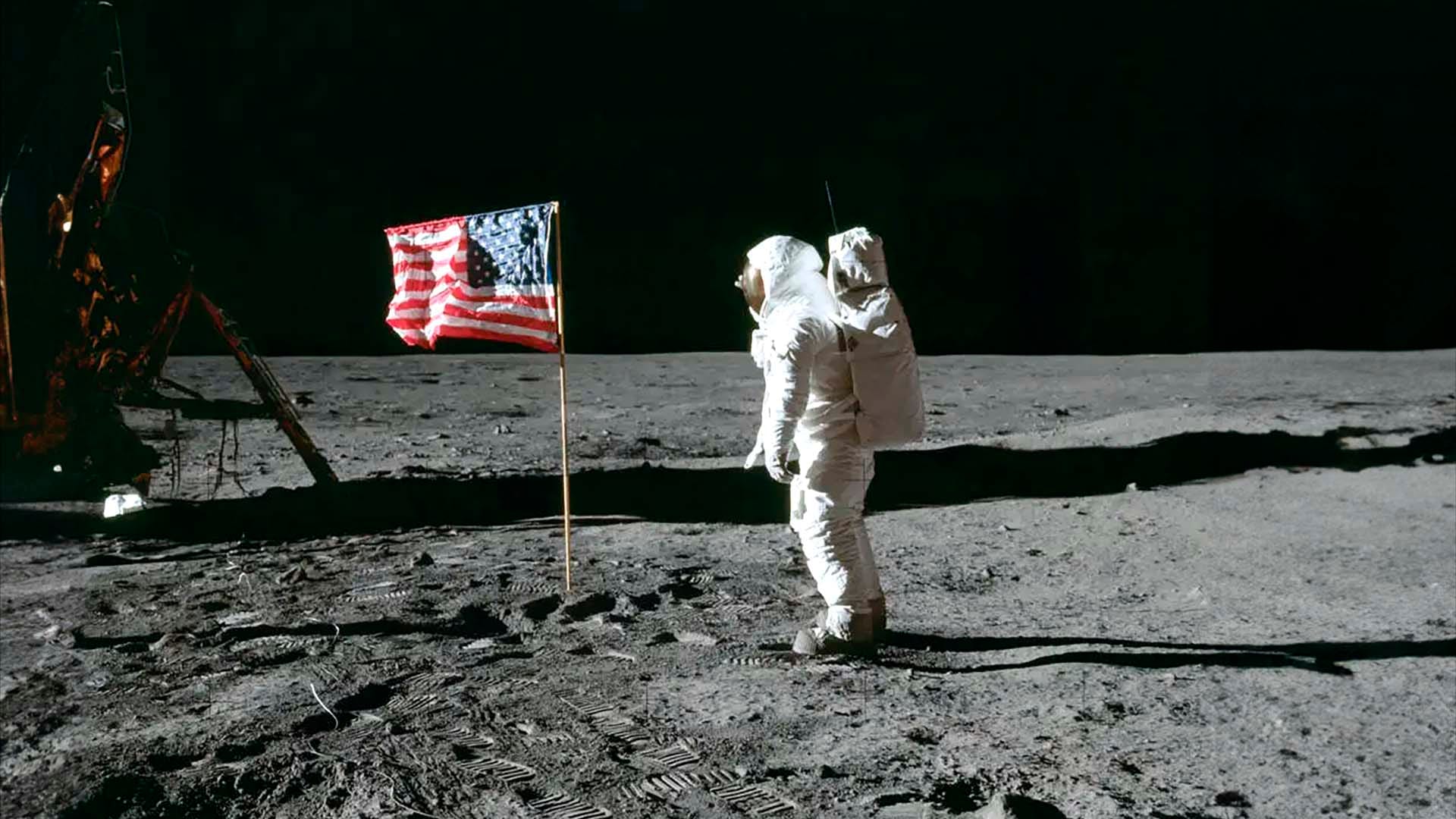 Buzz Aldrin salutes the US flag