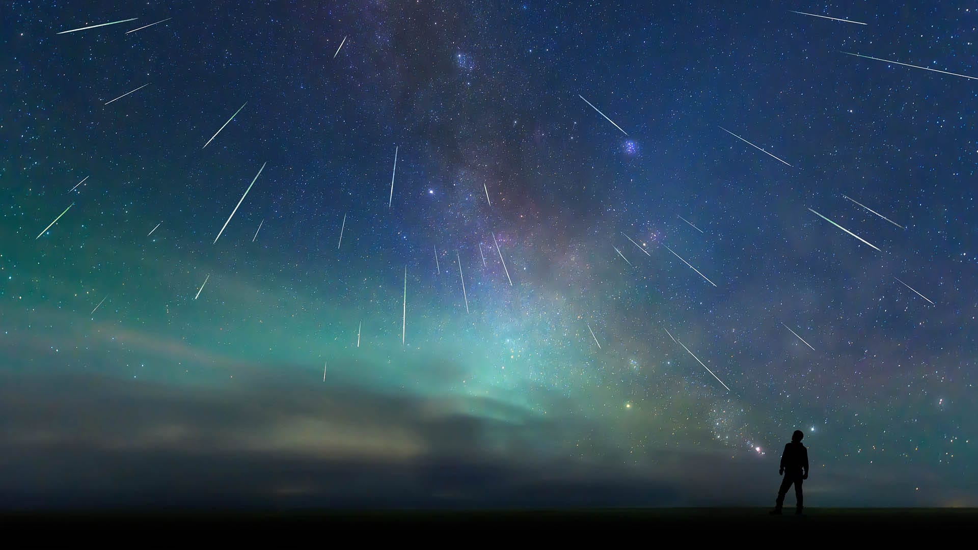Man observing a meteor shower