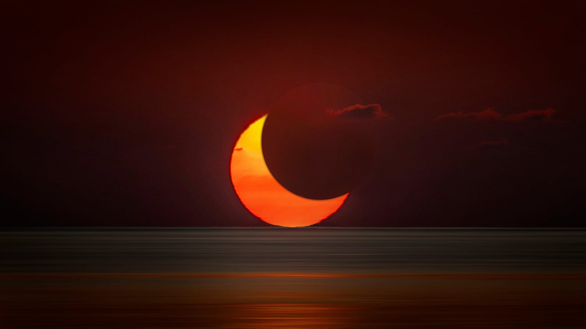 A solar eclipse at sunrise.